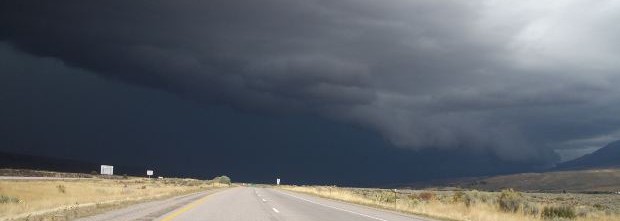 dark-clouds-over-road-and-meadow
