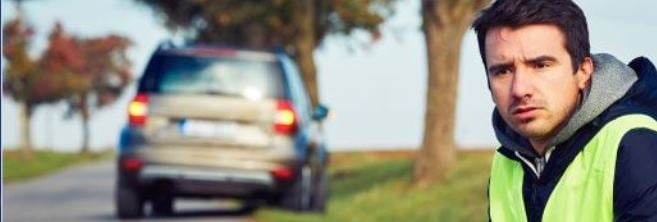 man-in-front-of-van-on-road