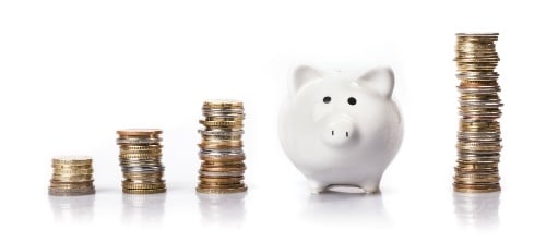 piles-of-coins-and-piggy-bank
