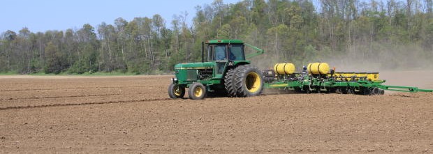 tractor-pulling-farming-equipment-across-field